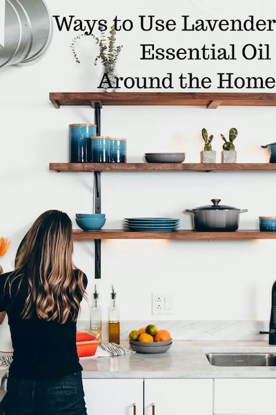 Woman working in kitchen with the words Ways to Use Lavender Essential Oil Around the Home