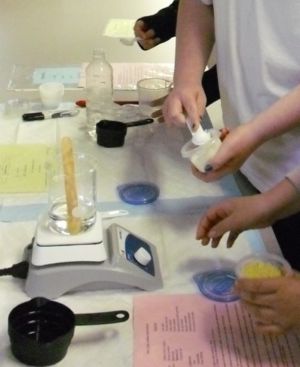 Photo of person making aromatherapy lotion.