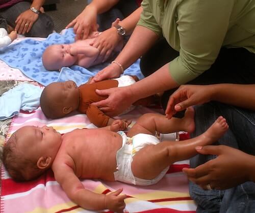 Babies receiving massage.