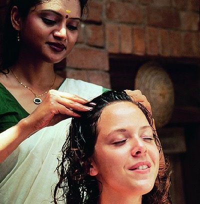 Woman receiving Indian Head Massage