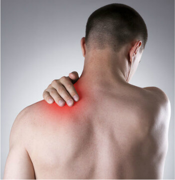 Frozen Shoulder Pain Relief Man holding hand on a painful shoulder | Frozen Shoulder Pain Relief