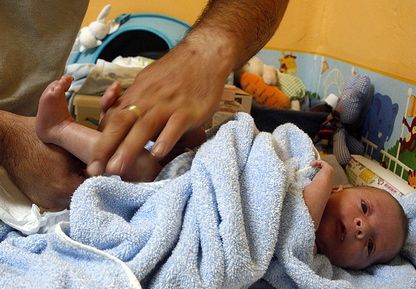 Infant receiving massage
